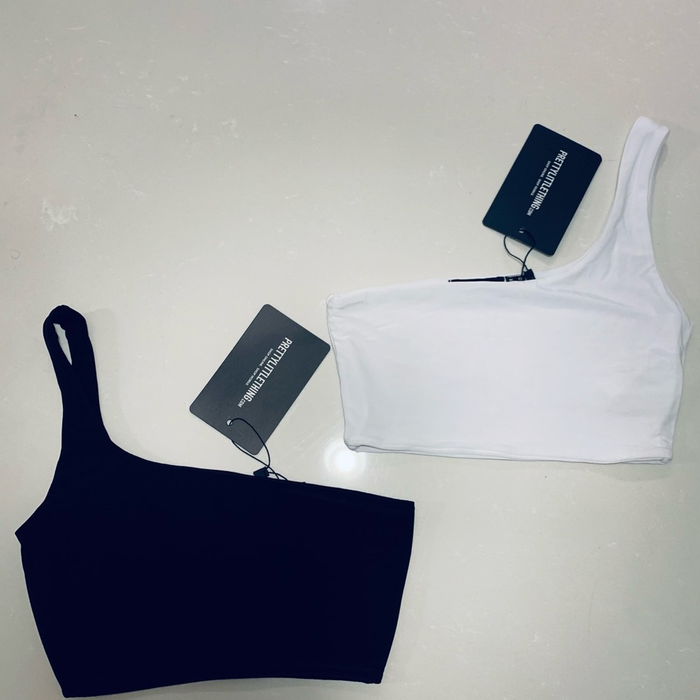 White and black slinky one shoulder crop tops! Both in size (2)